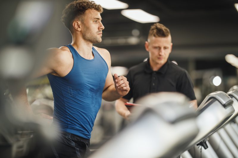 Shot,Of,An,Muscular,Young,Man,Jogging,On,The,Treadmill