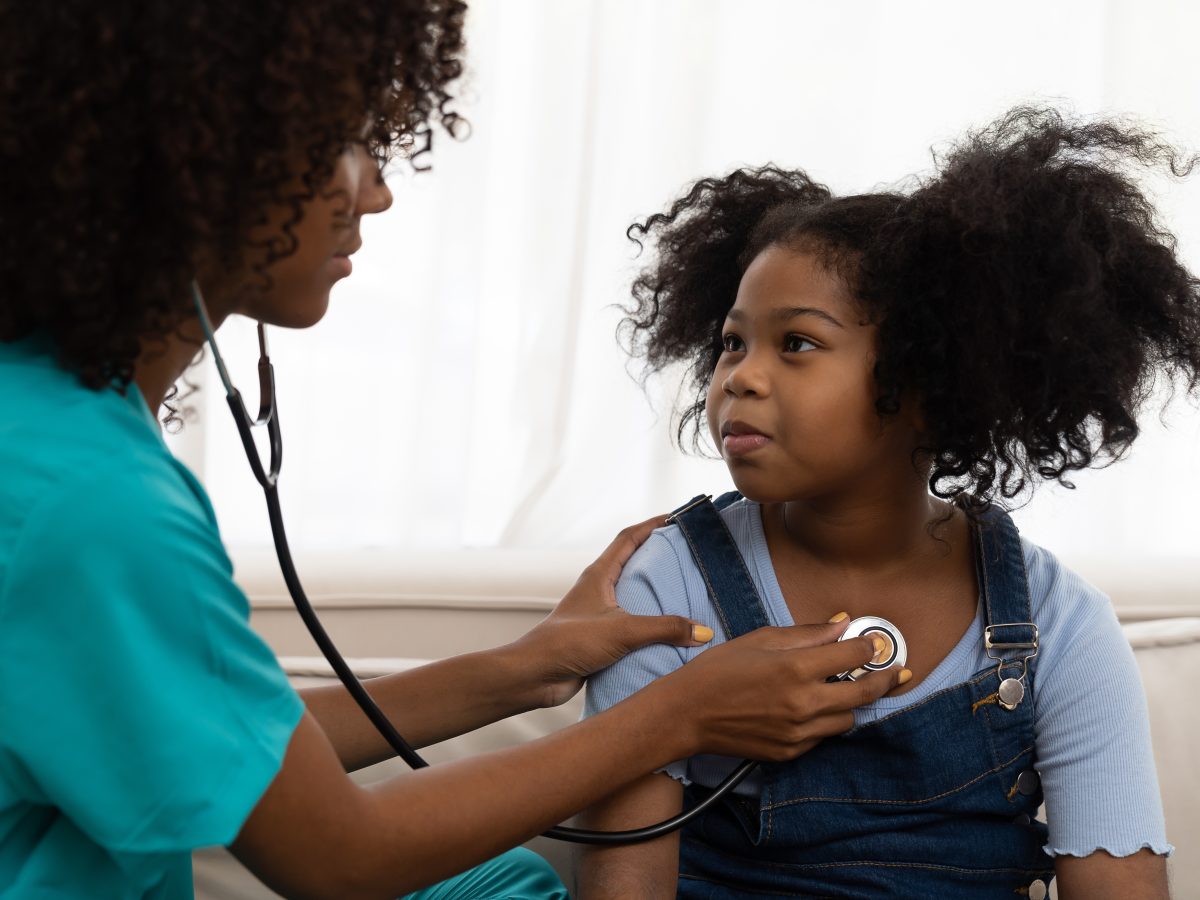 Female,Doctor,Examining,Kid,Child,Girl,By,Stethoscope,At,Hospital
