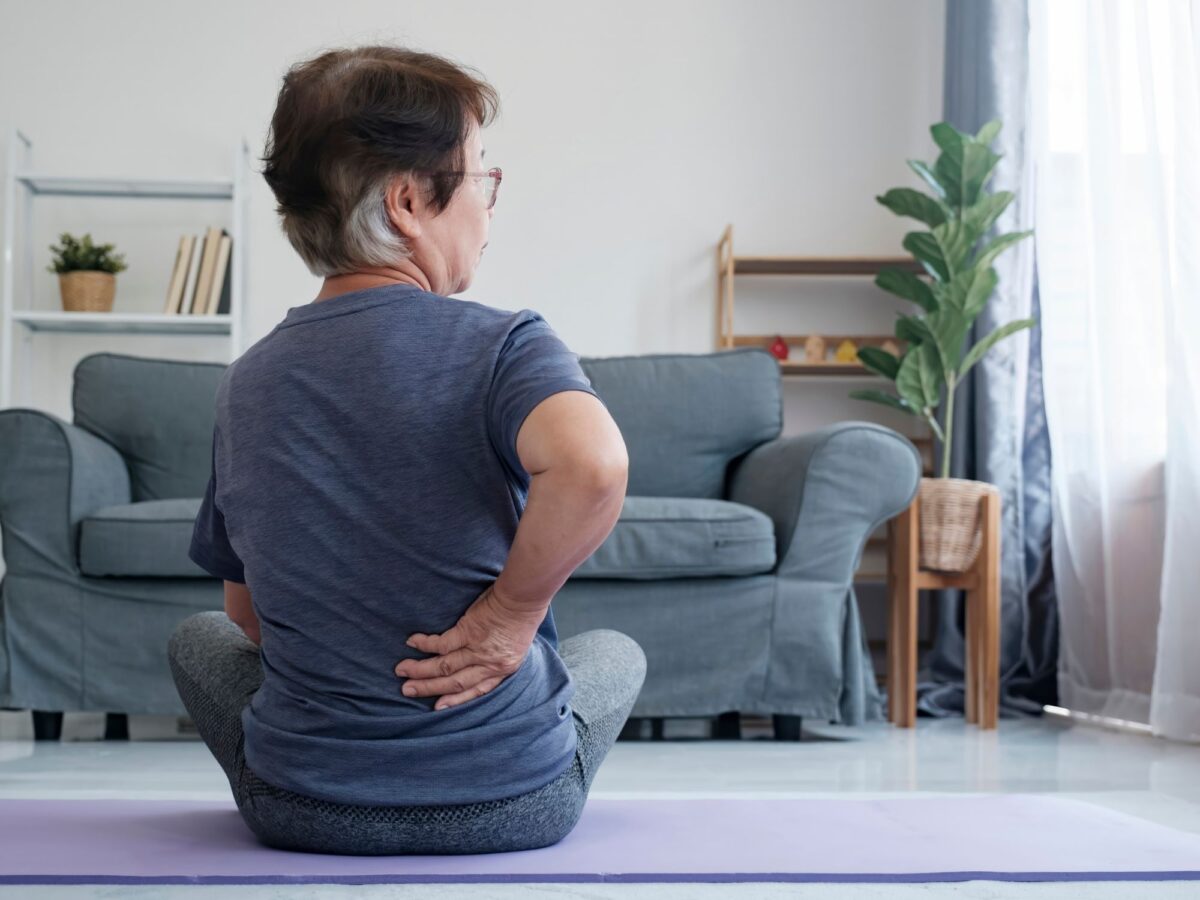 Lady doing a stretch for back pain