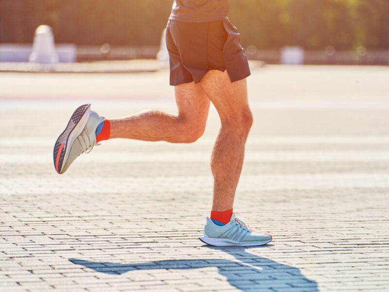 Male runner running outside