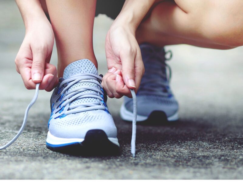 Lacing up trainers ahead of a run