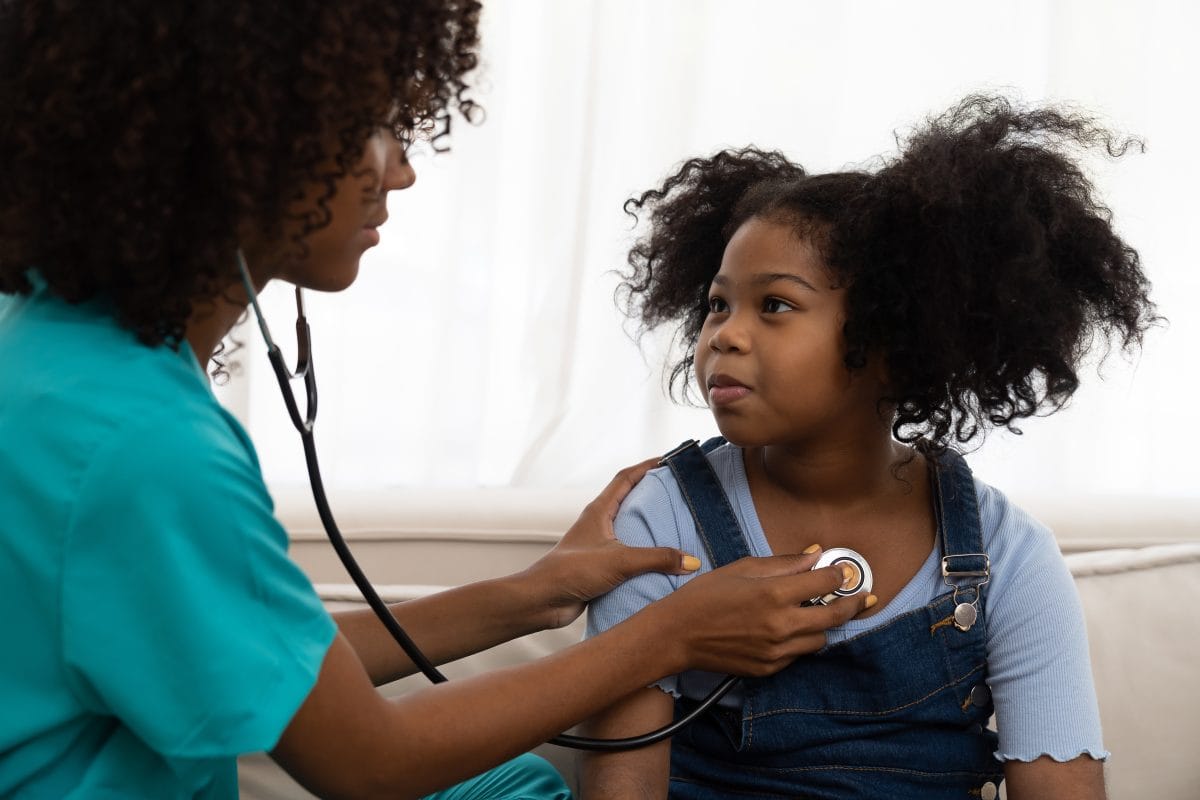 Female,Doctor,Examining,Kid,Child,Girl,By,Stethoscope,At,Hospital